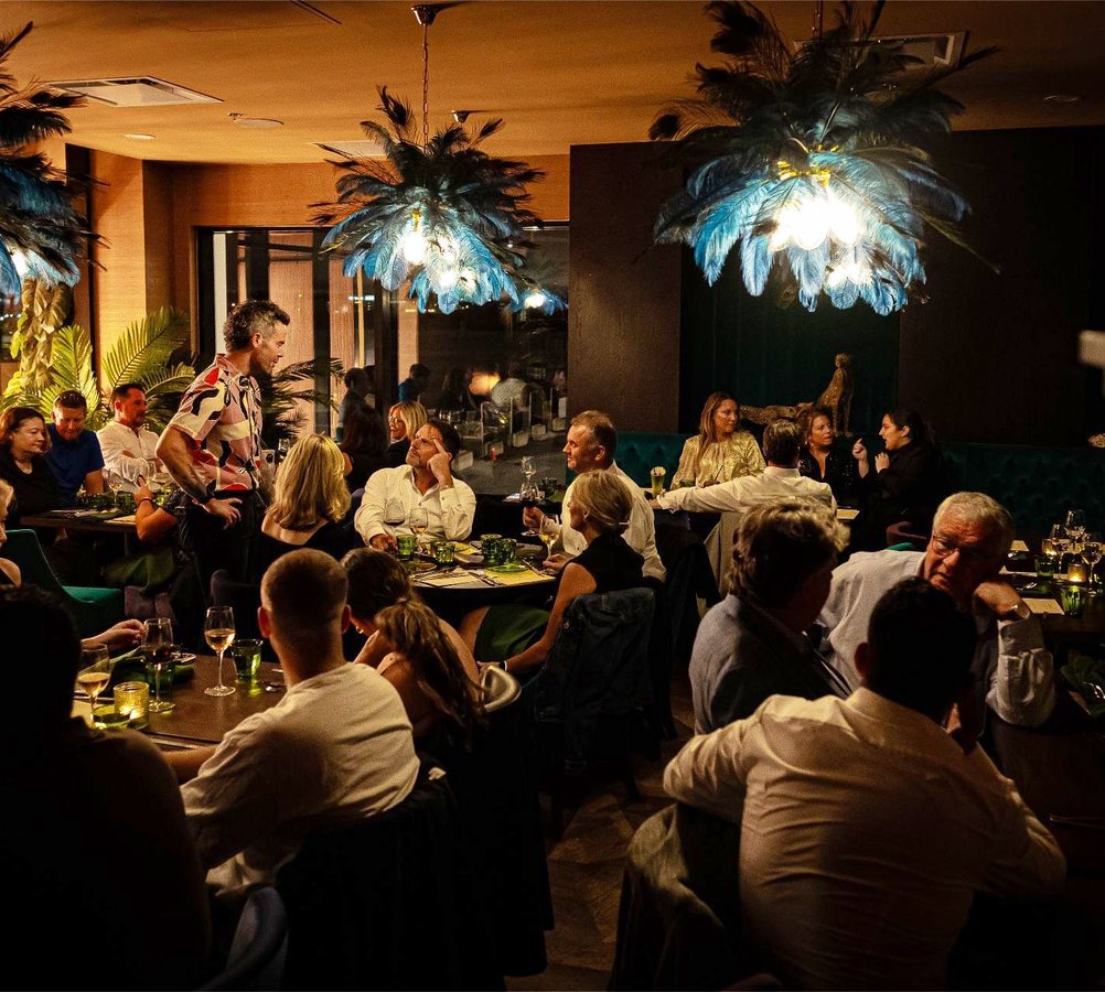 A full dining room in service at Beyond Hospitality Group