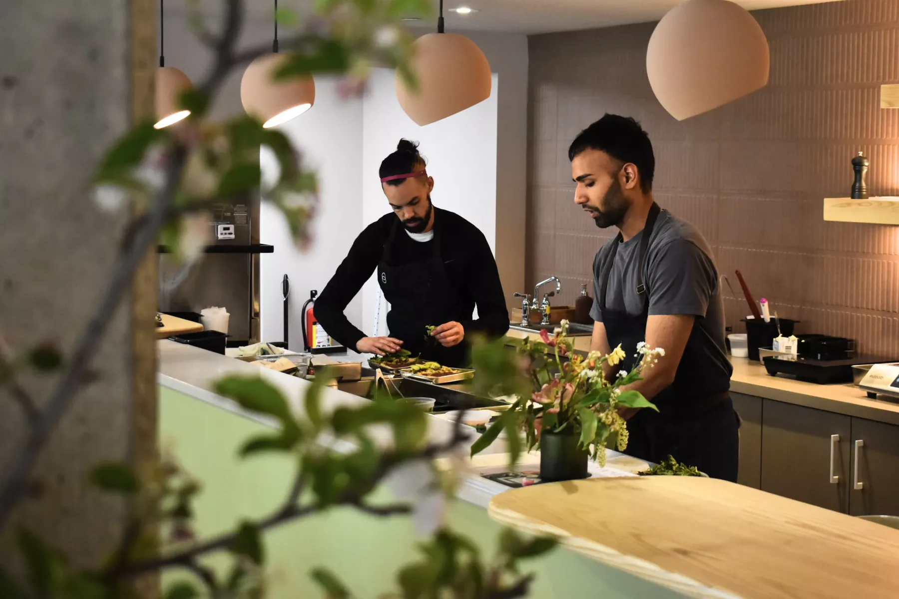 Two cooks at a kitchen counter