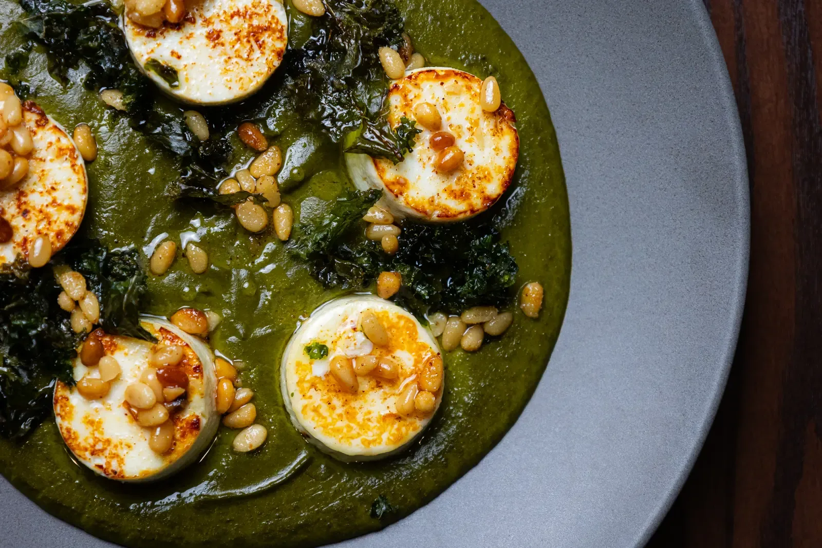 Seared rounds in a green sauce, close up