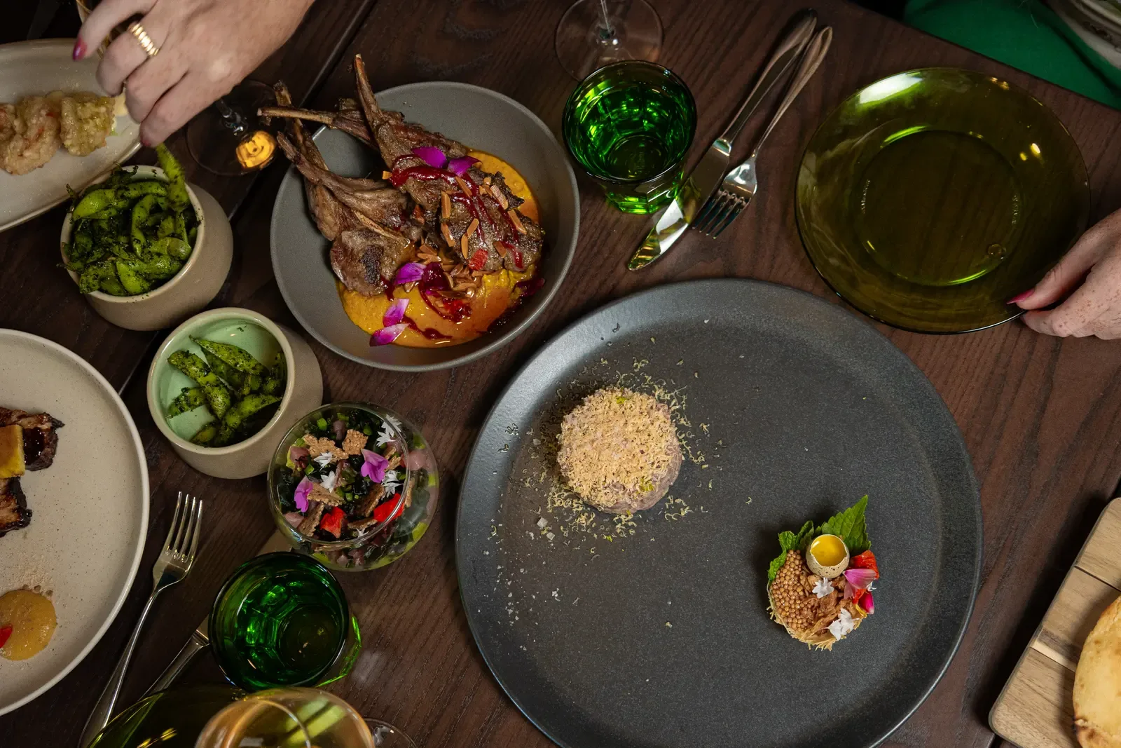 A table set with shared plates, from above
